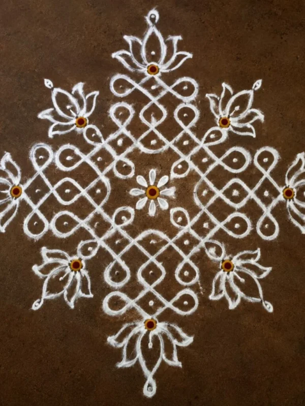 Turning Kolam Floor Art Into Hand Embroidery on a Red Saree