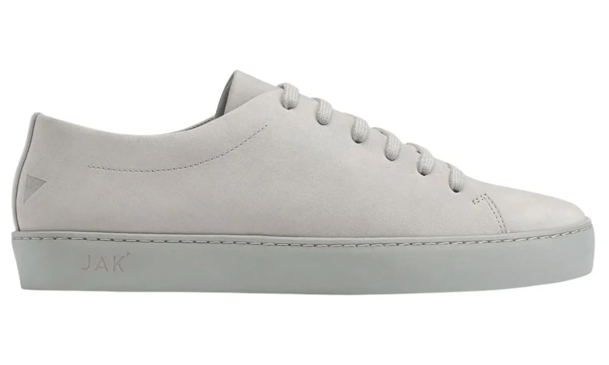 JAK grey suede low-top with subtle embossed branding on sole