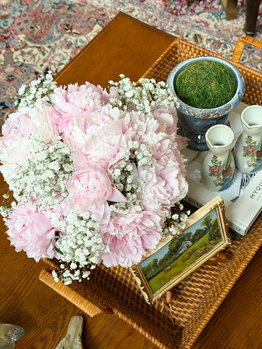 Pink peonies in the family room with styled coffee table