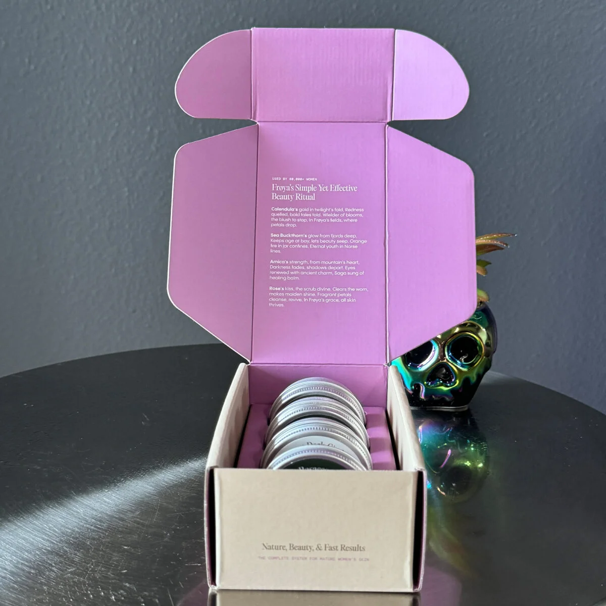 Unboxing Frøya Organics skincare products inside purple box