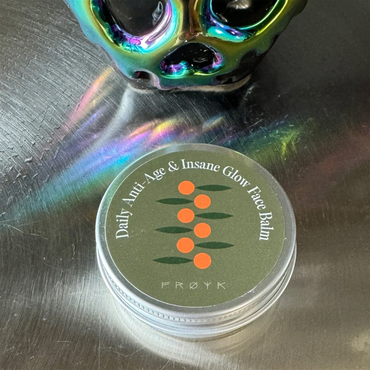 Daily Insane Glow Balm product tin close-up