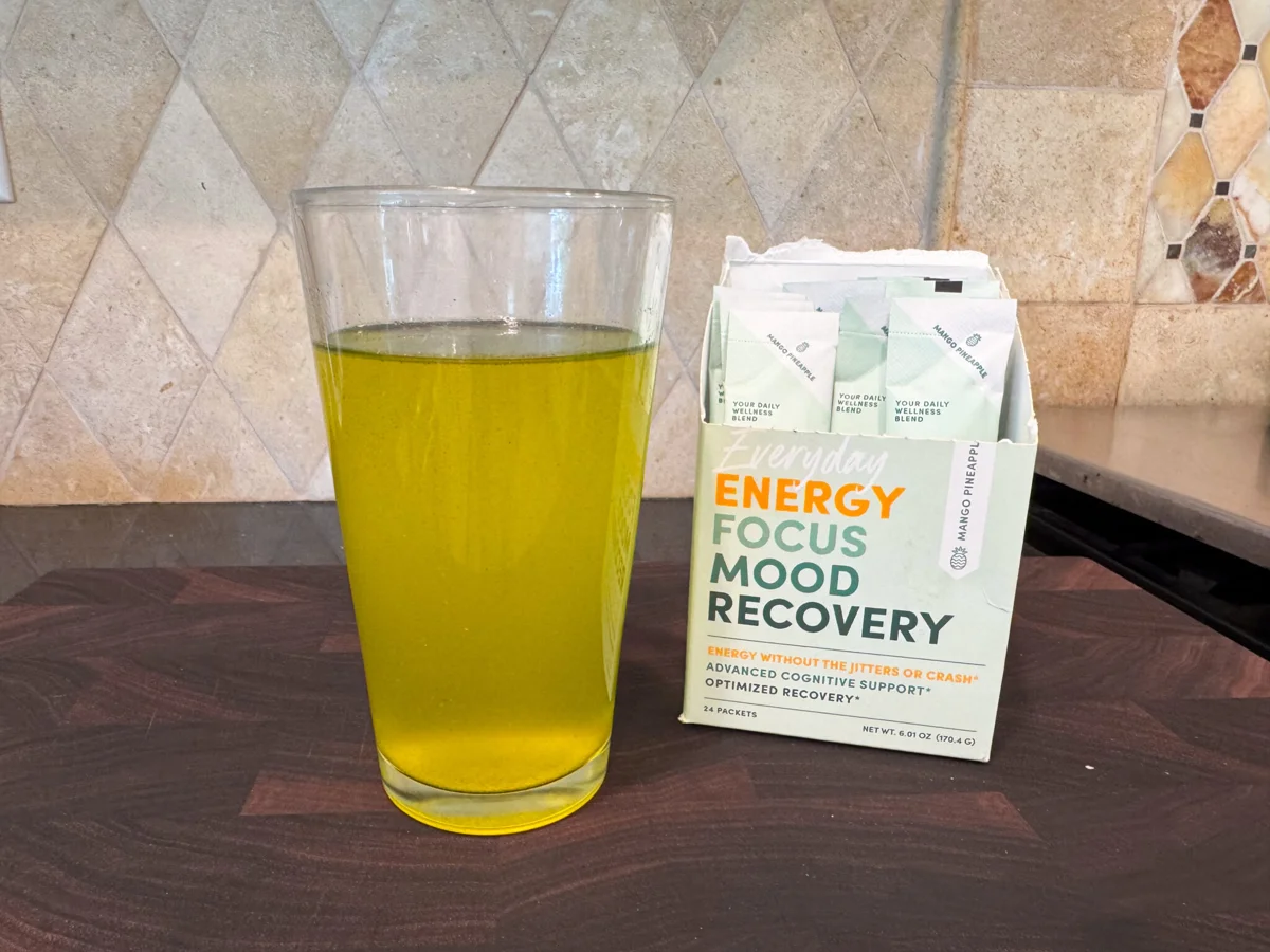 Glass of tropical energy drink beside MTE packets