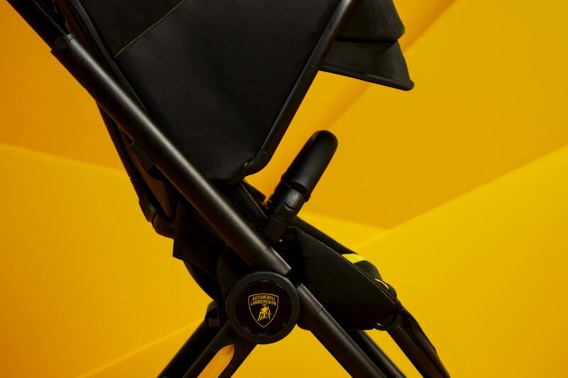 Close-up of stroller frame detail with Lamborghini logo